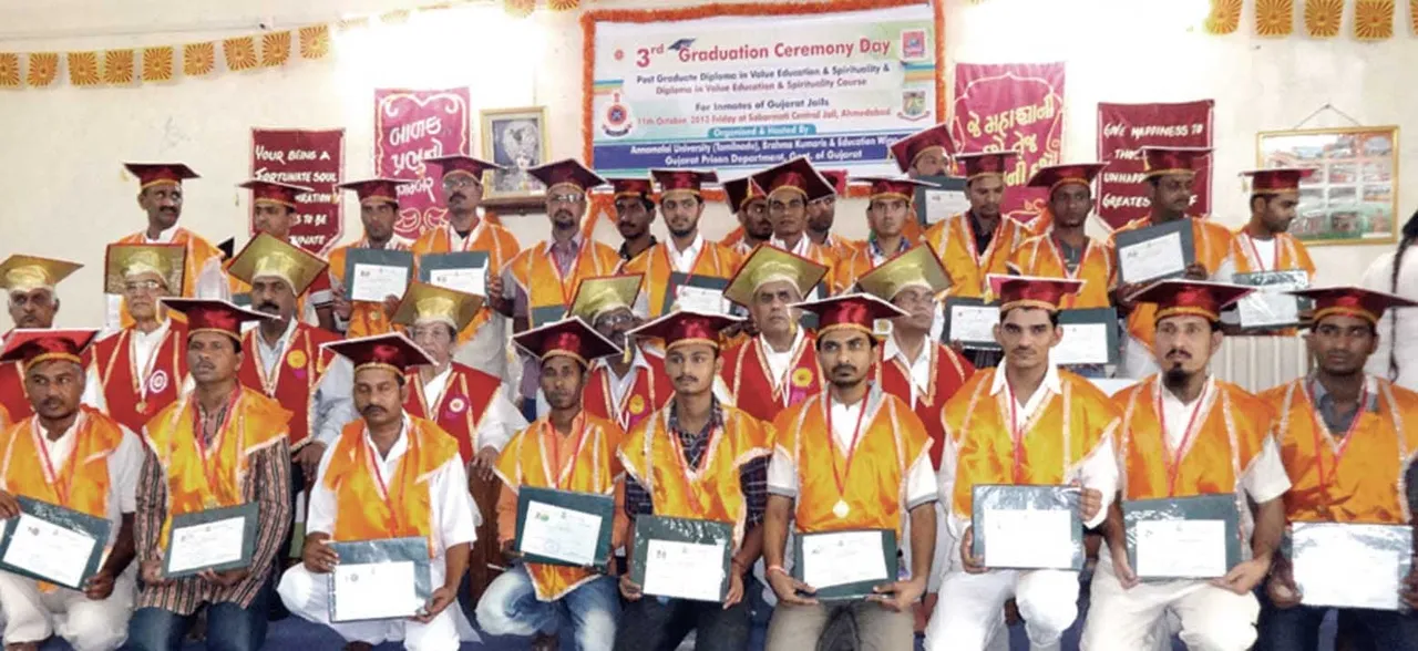 Prisoners of Sabarmati Jail after receiving graduation certificates, with University and Jail authorities.jpg