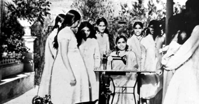 Didiji teaching sewing.jpg