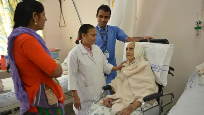 Care for a patient in a ward at Global Hospital, Mount Abu